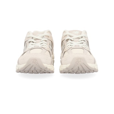 Ténis bege New Balance frontais com atacadores brancos