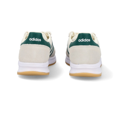 Traseira das sapatilhas Adidas em pele branca com detalhes verdes e sola castanha.