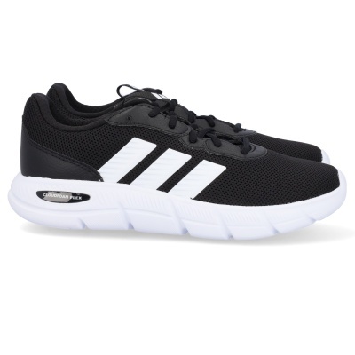 Sapatilhas desportivas pretas com riscas brancas e sola branca.