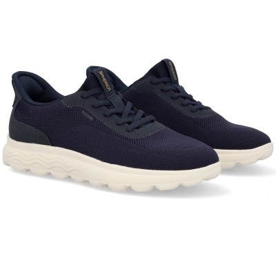 Sapatilhas desportivas azuis com sola branca e etiquetas SPHERICA e GEOX.