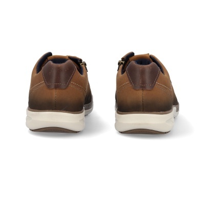 Sapatos castanhos castanhos escuro sola branca fotografia atrás