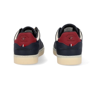 Ténis de couro azul escuro com detalhes vermelhos e brancos e sola bege vistos de trás