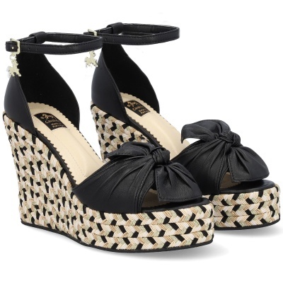 Sandálias de cunha com padrão trançado e laço preto