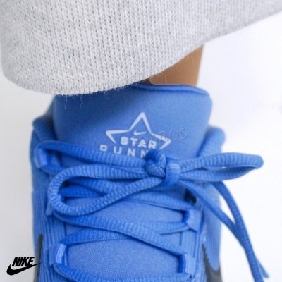 Tênis azul com logo NIKE e texto STAR RUNNER na língua