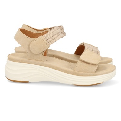 Sandálias de senhora bege com sola branca alta e fecho ajustável.