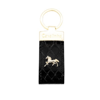 Chaveiro preto de pele com aplique dourado de cavalo e gravação Cavalinho.