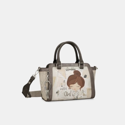 Mala de mão bege e castanha com desenho e alças duplas