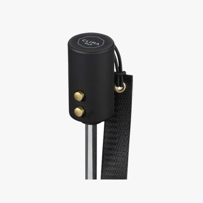 Suporte com botão dourado e texto CLIMA LASH