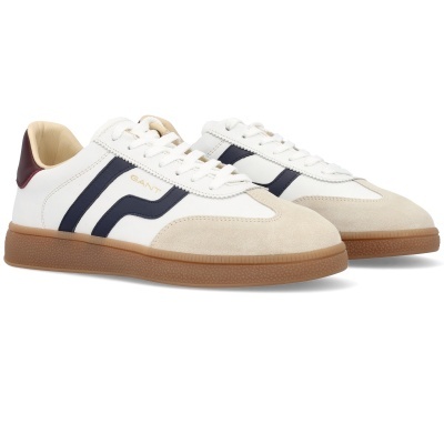 Ténis brancos com riscas azuis e sola castanha