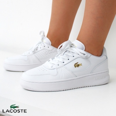 Ténis Lacoste brancos com crocodilo dourado e atacadores brancos