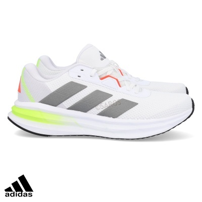 Ténis brancos Adidas com riscas cinzentas e detalhes neon
