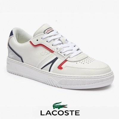 Ténis desportivo branco Lacoste com detalhes azuis e vermelhos