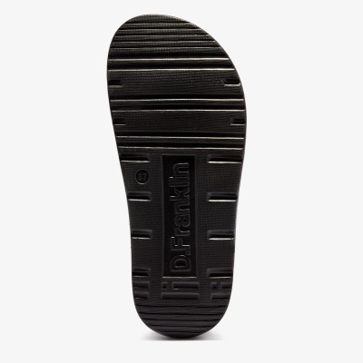 Sola preta de calçado com texto Dr.Franklin e riscas horizontais