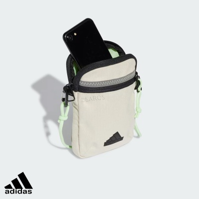 Bolsa pequena Adidas Saros bege com telemóvel preto