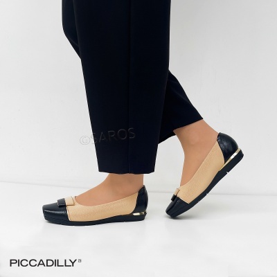 Sapatos rasos bicolores bege e preto com laço e detalhe dourado no salto