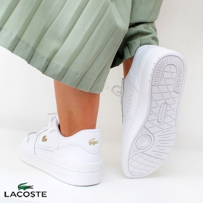 Sapatos desportivos brancos Lacoste com sola espessa e logótipo dourado