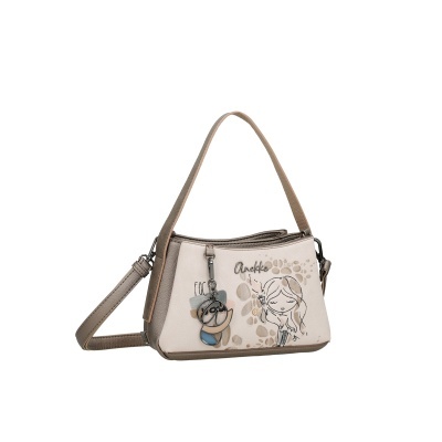 Mala Anekke bege e castanha com desenho de menina e chaveiro decorativo