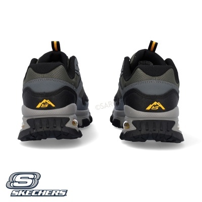 Ténis de caminhada Skechers cinza, preto e amarelo vistos de trás