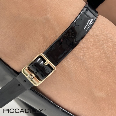 Fecho dourado em tira preta brilhante de calçado com logo PICCADILLY