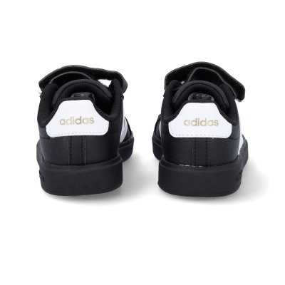 Sapatilhas pretas Adidas com detalhe branco e texto dourado vistas de trás