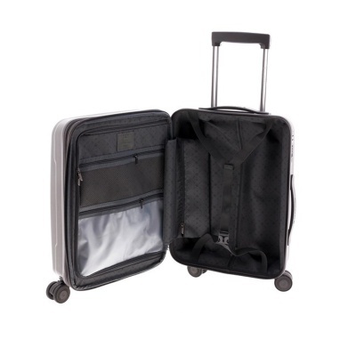 Mala de viagem rígida cinzenta aberta mostrando o interior preto com compartimentos e rodas.