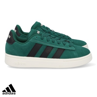 Sapatilhas Adidas verdes com riscas pretas e sola branca