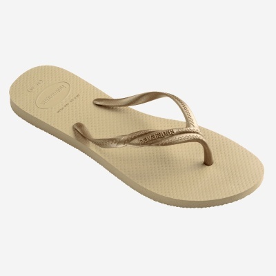 Chinelo Havaianas bege com tiras douradas e sola pontilhada