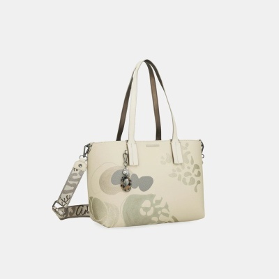 Mala de ombro creme com padrão animal print e alças duplas.