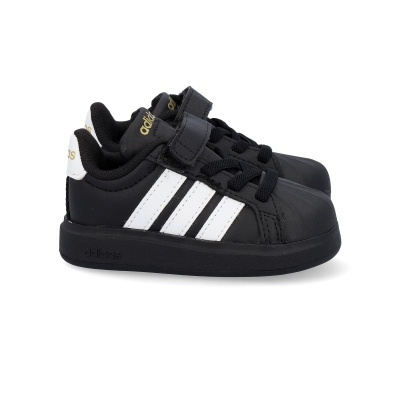 Sapatilhas Adidas pretas com riscas brancas e fecho velcro para criança.