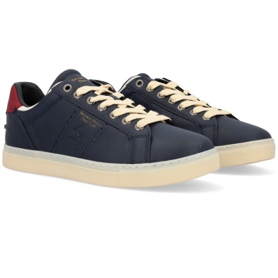 Ténis azuis com atacadores creme, sola branca e detalhe vermelho no calcanhar