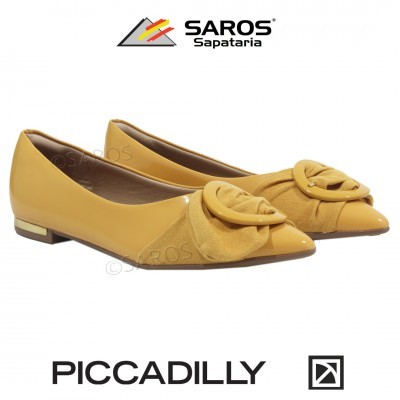 Sapatilhas amarelas femininas com detalhe circular na frente em fundo branco