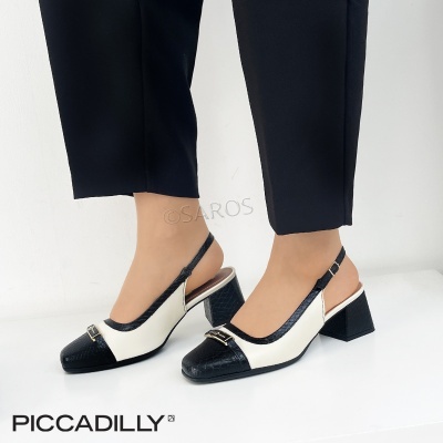 Sapatos de salto médio bicolor preto e branco com fivela dourada