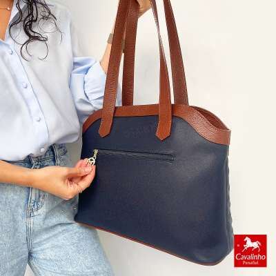 Mala feminina azul e castanha com fecho de correr e alças largas