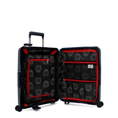 Mala de viagem preta rígida aberta mostrando interior forrado com padrão e detalhes vermelhos