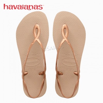 Chinelos Havaianas bege e cobre com tiras finas em laço