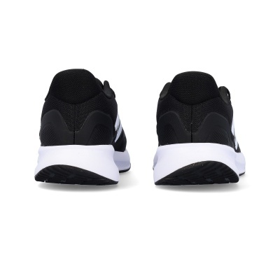 Sapatilhas desportivas pretas com sola branca vistas de trás