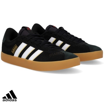 Sapatilhas adidas pretas com riscas brancas e sola castanha