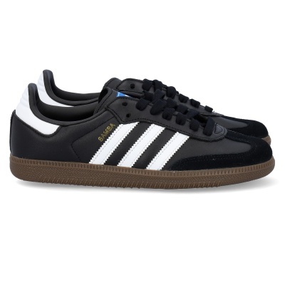 Sapatilhas Adidas Samba pretas com riscas brancas e sola castanha.