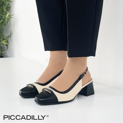 sapatos de senhora bicolor preto e branco com salto médio e fivela ajustável