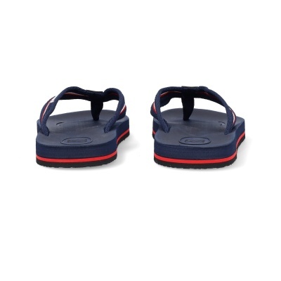 Chinelos azuis escuros com sola azul e risca vermelha vistos de trás