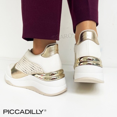 Ténis femininos brancos com detalhes dourados metálicos e sola branca com riscas douradas