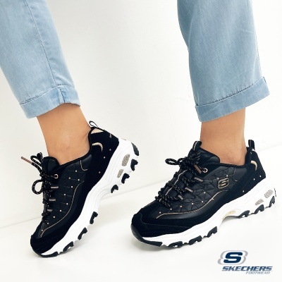 Ténis pretos Skechers com sola branca e detalhes em bege
