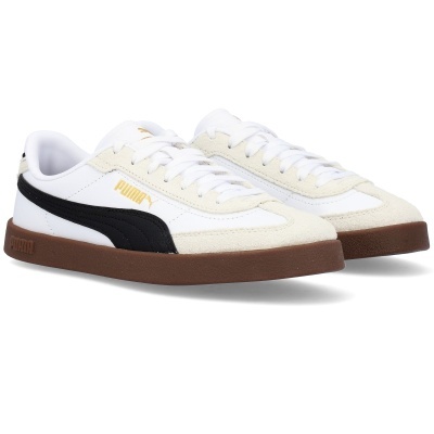 Ténis Puma branco com detalhes bege e preto e sola castanha.