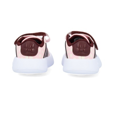 Ténis infantis rosa com padrão de bolinhas e sola branca vistos de trás