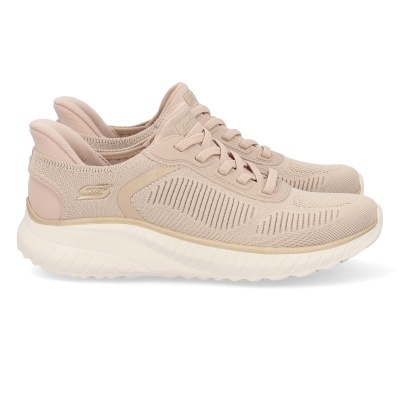 Ténis bege claro com sola branca e detalhes em tecido e couro sintético.