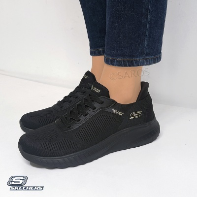 Ténis pretos Skechers em malha com sola espessa e logótipos dourados