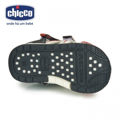 Sola de sandália infantil preta com pontos brancos e texto FLEX ZONE