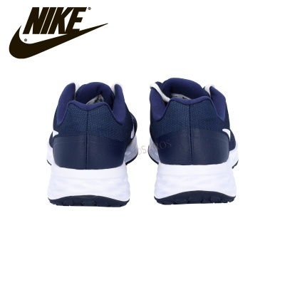 Ténis desportivos Nike azul escuro com solado branco vistos de trás