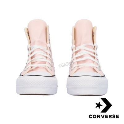 Ténis Converse rosa claro com atacadores brancos vista frontal
