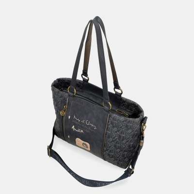 Mala preta com padrão bordado e alças duplas